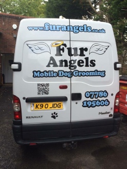 QR Code on the back of a van. Click to visit Fur Angels website